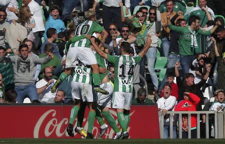 Football Soccer - Real Betis v Barcelona - Spanish Liga Santander - Benito Villamarin stadium, Seville, Spain - 29/01/2017 Real Betis' players celebrate after Alex Alegria scored their first goal. REUTERS/Jon Nazca