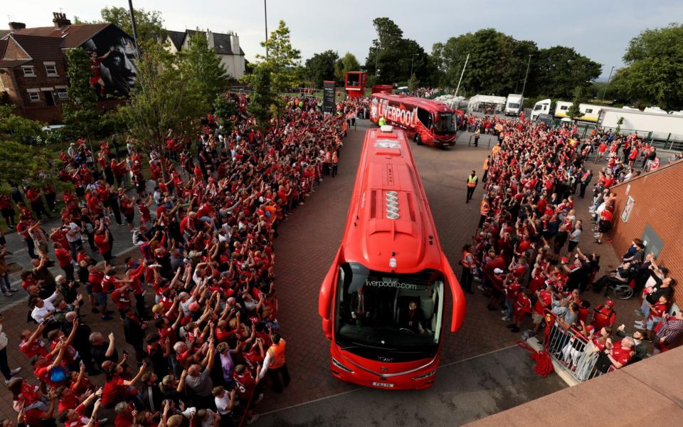 Fans watch on as Liverpool arrive ahead of the Premier League match between Liverpool FC and Crystal Palace - Getty Images Europe