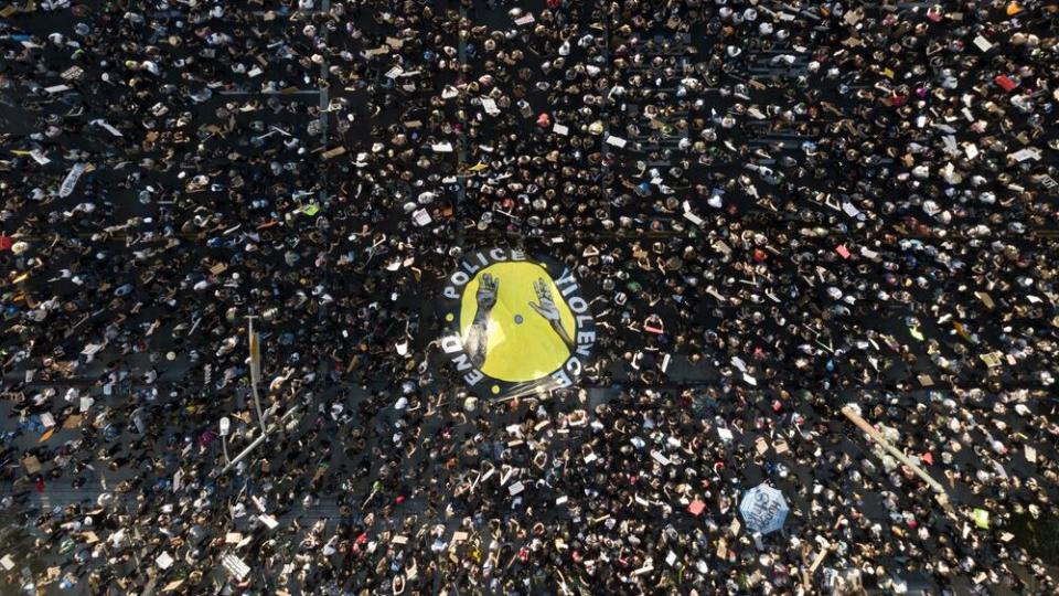 In this June 3, 2020, file photo demonstrators take part in a protest in downtown Los Angeles, sparked by the death of George Floyd, who died May 25 after he was restrained by Minneapolis police. (AP Photo/Ringo H.W. Chiu, File)