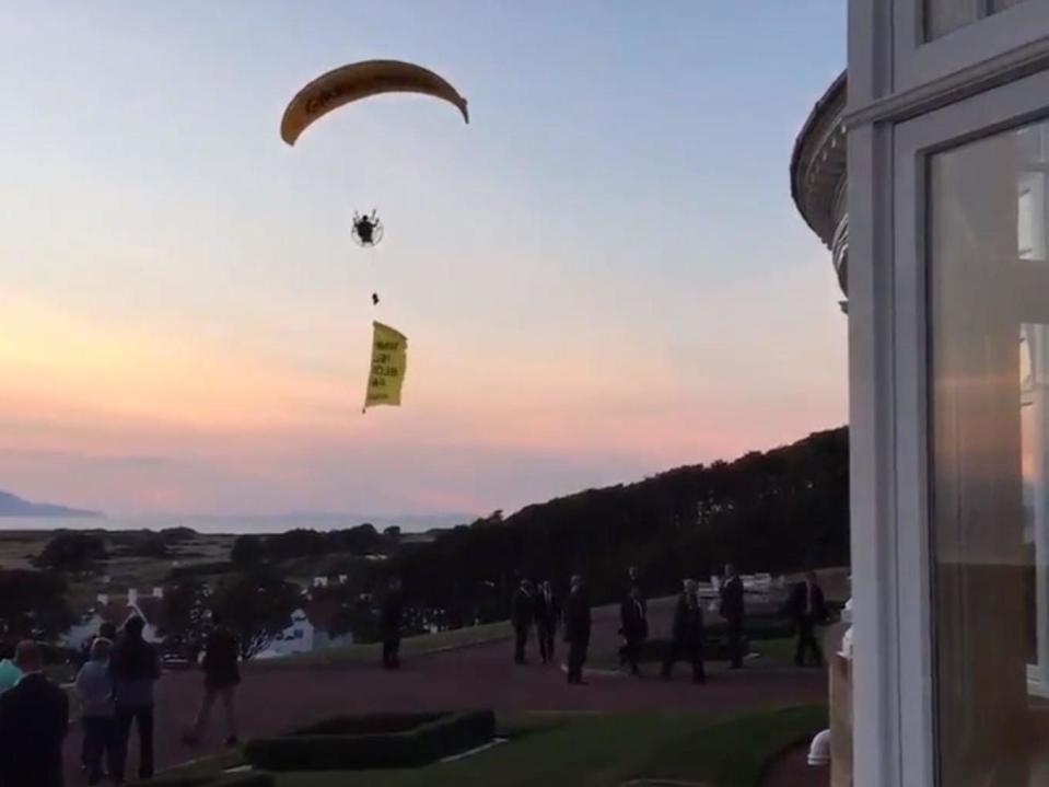 Trump UK visit: Man charged over paraglider protest at US president's golf course in Scotland