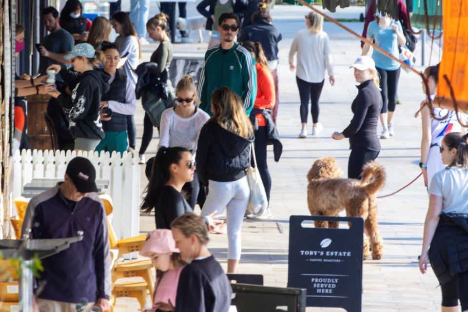 People walking on the street in the Sydney beachside suburb of Bronte.