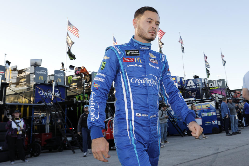 FILE - In this Oct. 18, 2019, file photo, Kyle Larson walks to the garage before the final practice for a NASCAR Cup Series auto race at Kansas Speedway in Kansas City, Kan. Kyle Larson was banished from NASCAR for all but the first month of his last season, his punishment for using a racial slur while racing online. Rick Hendrick felt the driver paid his penalty and deserved a second chance, one that begins with the season-opening Daytona 500. (AP Photo/Colin E. Braley, File)