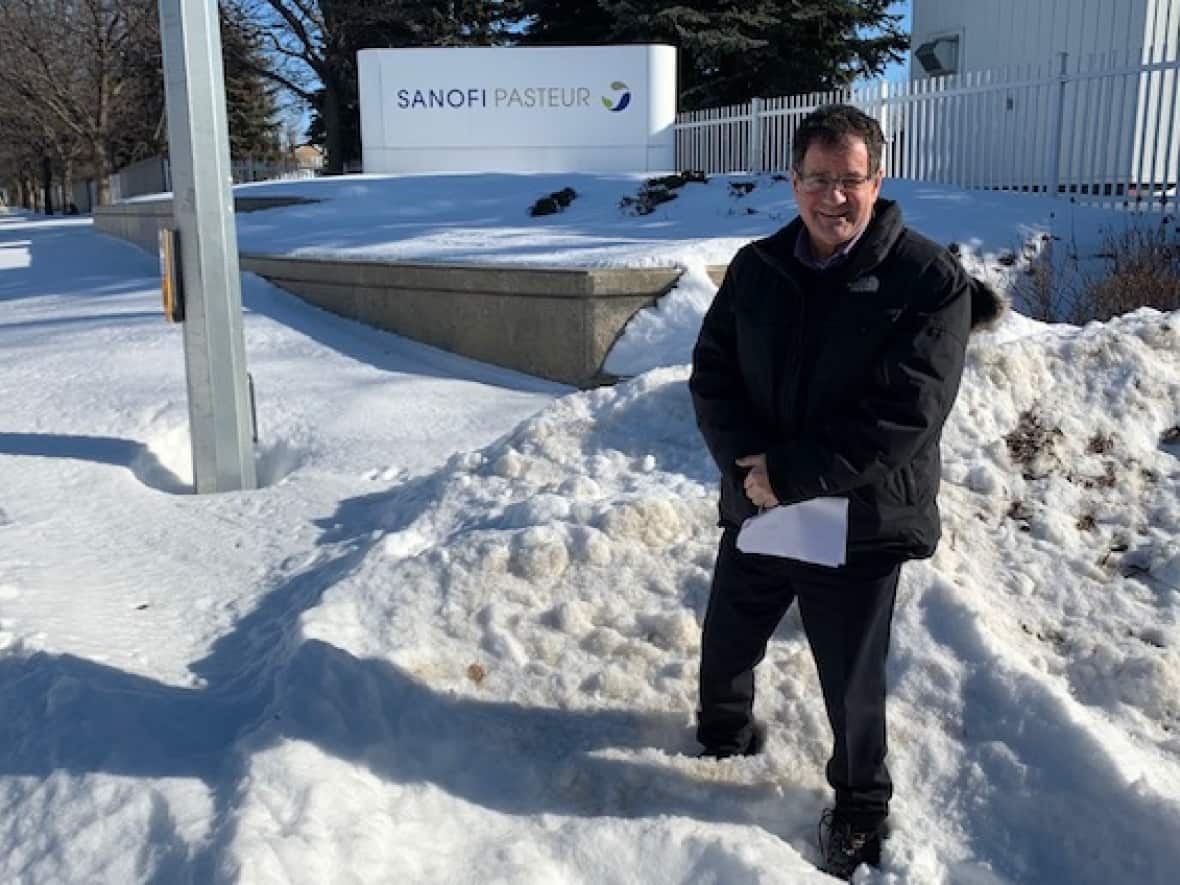 Coun. James Pasternak is seen at the front entrance to Sanofi Pasteur's 21-hectare campus in Toronto's north end. The vaccine maker says it's expanding and needs assurances its operations can be secure. (Mike Smee/CBC - image credit)