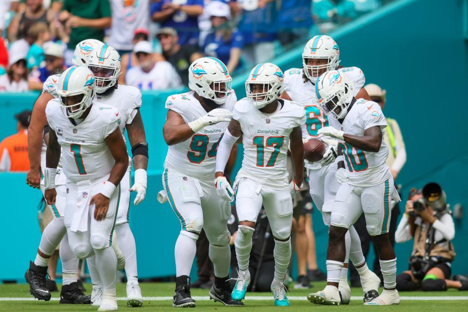 Oct 8, 2023; Miami Gardens, Florida, USA; Miami Dolphins wide receiver Jaylen Waddle (17) celebrates with teammates after scoring a touchdown against the New York Giants at Hard Rock Stadium. Mandatory Credit: Sam Navarro-USA TODAY Sports
