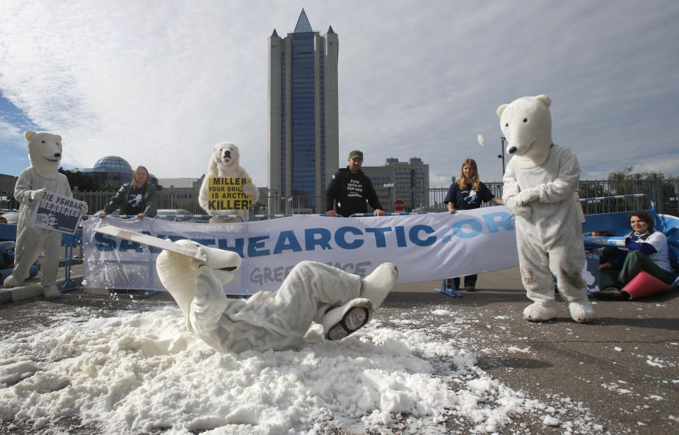 Greenpeace activists dressed as polar bears protest outside Gazprom's headquarters in Moscow, Russia, Wednesday, Sept. 5, 2012. Russian and international environmentalists are protesting against Gazprom's plans to pioneer oil drilling in the Arctic. (AP Photo/Misha Japaridze)