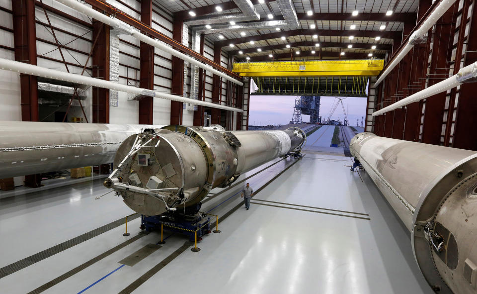 Recovered first stages of three SpaceX Falcon 9 rocket are shown during a photo opportunity in the SpaceX hangar at launch pad 39A at the Kennedy Space Center in Cape Canaveral