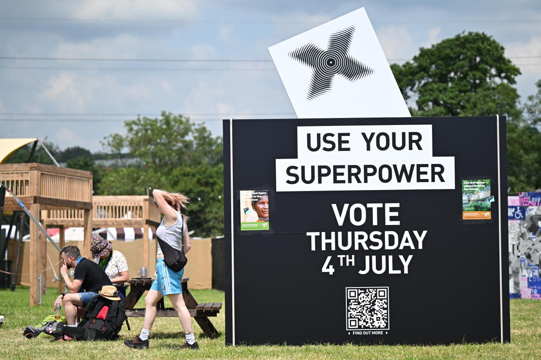 GLASTONBURY, ENGLAND - JUNE 26: An art installation featuring a giant ballot box from the Just Vote campaign, reminding festival-goers to vote on July 4th, is displayed during day one of Glastonbury Festival 2024 at Worthy Farm, Pilton on June 26, 2024 in Glastonbury, England. Founded by Michael Eavis in 1970, Glastonbury Festival features around 3,000 performances across over 80 stages. Renowned for its vibrant atmosphere and iconic Pyramid Stage, the festival offers a diverse lineup of music and arts, embodying a spirit of community, creativity, and environmental consciousness. (Photo by Leon Neal/Getty Images)