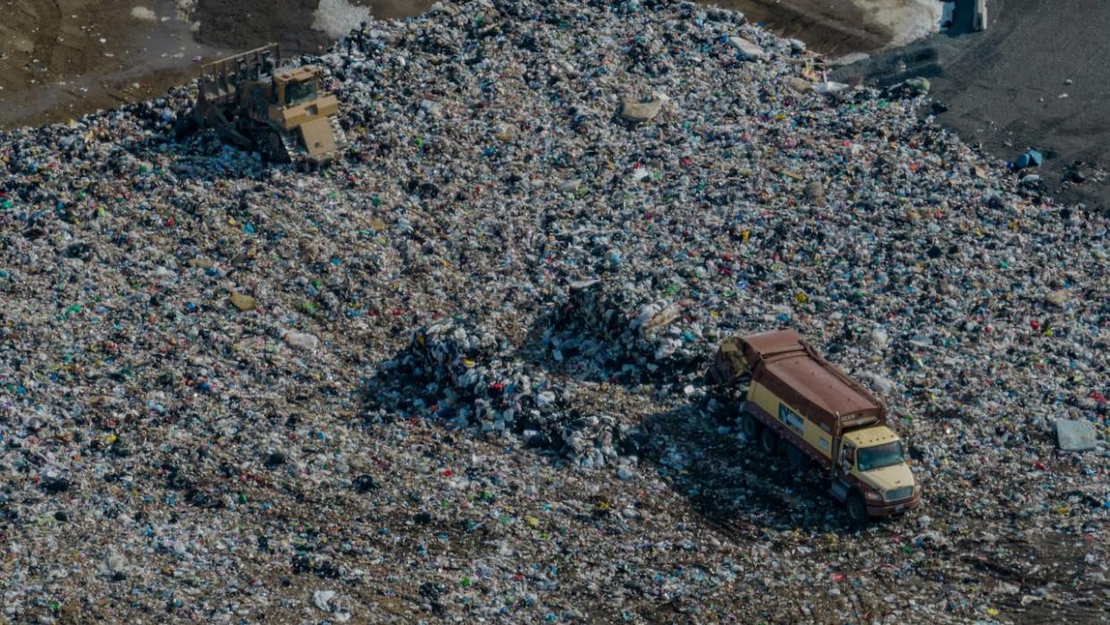 A truck offloads trash at Ottawa's Trail Road landfill on Feb. 27, 2024. City councillors are running out of time to decide what to do once the rapidly filling dump reaches capacity. (Michel Aspirot/CBC - image credit)