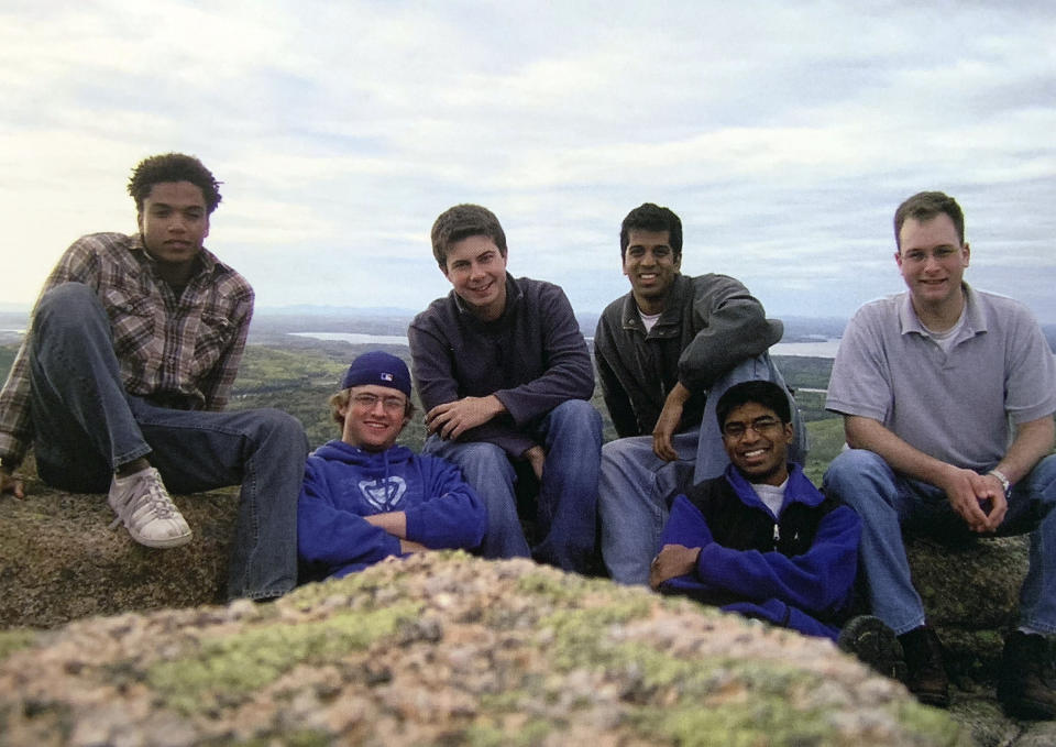 In this image provided by the Pete Buttigieg presidential campaign, Pete Buttigieg poses with friends in 2004 during his senior year at Harvard. From left to right: Randall Winston, Nathaniel Myers, Buttigieg, Previn Warren, Ganesh Sitaraman, and Ryan Rippel. (Pete Buttigieg Presidential Campaign via AP)