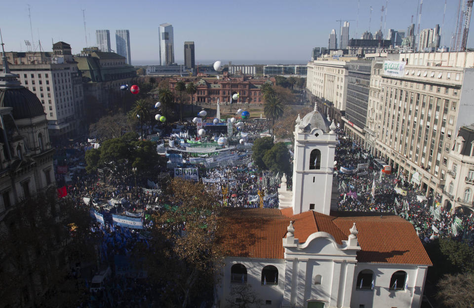 Demonstrators fill Plaza de Mayo in front of the government palace in Buenos Aires, Argentina, Wednesday, June 27, 2012. A strike and demonstration called by union leader Hugo Moyano demands steps that would effectively reduce taxes on low-income people, among other measures. (AP Photo/Eduardo Di Baia)