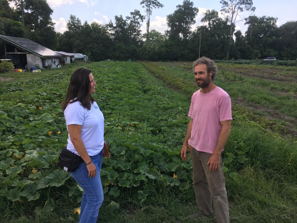 Catherine Campbell of University of Florida’s Institute of Food and Agricultural Sciences with Cody Galligan at his southeast Gainesville farm.