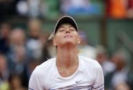 Maria Sharapova of Russia celebrates after beating Samantha Stosur of Australia during their women's singles match at the French Open tennis tournament at the Roland Garros stadium in Paris, France, May 29, 2015. REUTERS/Jean-Paul Pelissier TPX IMAGES OF THE DAY