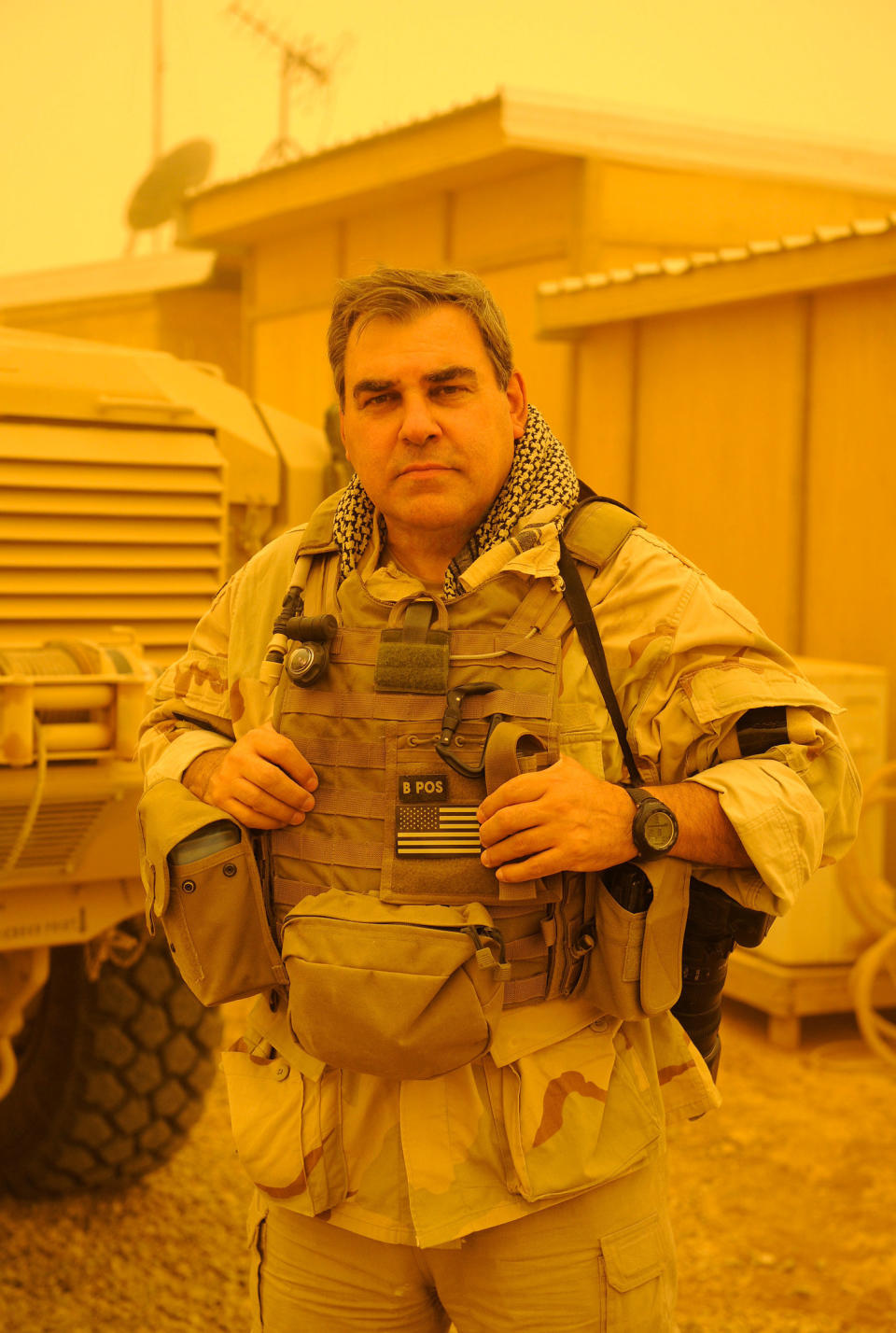 Author and photographer, Greg E. Mathieson Sr. stands in a dust storm at the secluded US Navy SEAL base in Fallujah, Iraq while producing exclusive material for the newly released book, US Naval Special Warfare / US Navy SEALs.