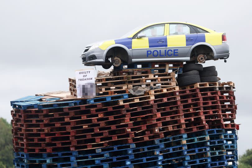 Mocked up police car on top of the bonfire in Moygashel
