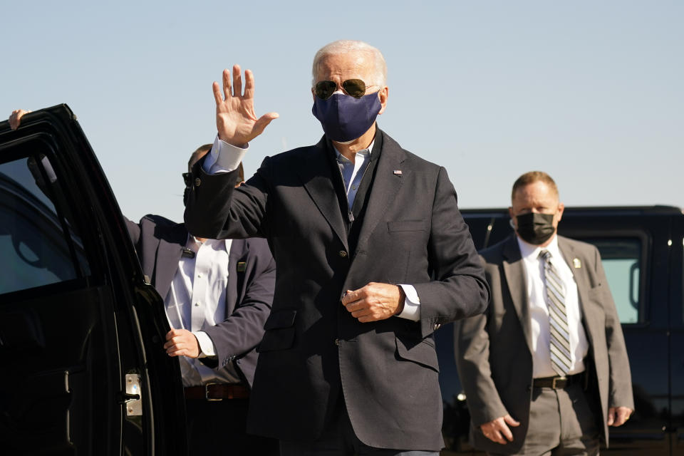 Democratic presidential candidate former Vice President Joe Biden arrives to board his campaign plane at the New Castle Airport in New Castle, Del., Sunday, Oct. 18, 2020, en route to Durham, N.C. (AP Photo/Carolyn Kaster)