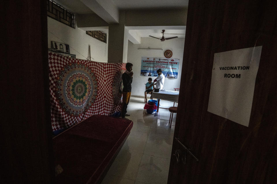 A boy receives vaccine for COVID-19 at a private vaccination center in Gauhati, India, Sunday, April 10, 2022. (AP Photo/Anupam Nath)