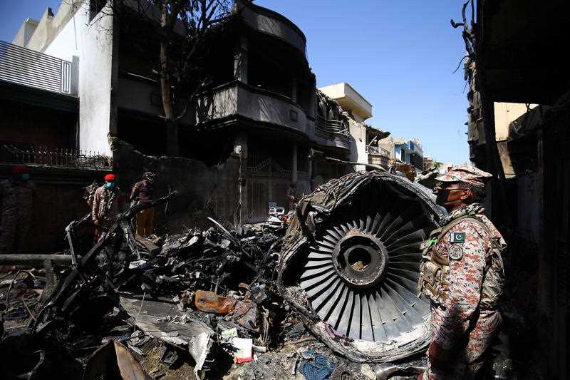 Wreckage of state run Pakistan International Airlines, Airbus A320 is lying amid houses of a residential colony days after it crashed, in Karachi, Pakistan.