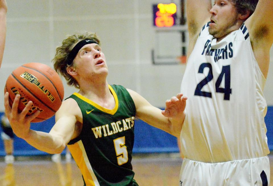 Northwestern's Nathan Melius drives against Great Plains Lutheran's Myles York during a high school basketball doubleheader on Thursday, Feb. 9, 2023 in Watertown.