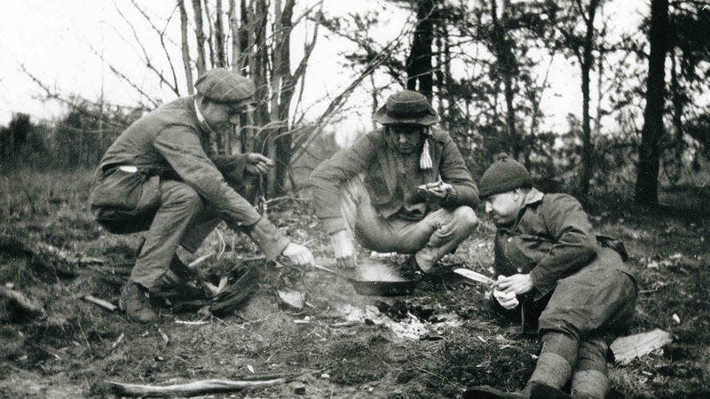 An image of Ernest Hemingway (left) with friends while camping at the Pine Barrens.