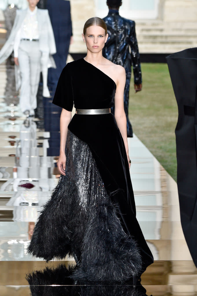 <p>Model wears a black velvet one-shoulder and metallic contrast gown from the Givenchy fall 2018 couture collection. (Photo: Getty Images) </p>