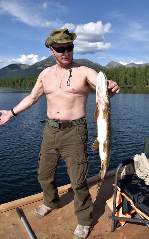 Mr Putin is known for his macho stunts and shirtless photographs, such as this picture of him fishing in Siberia in 2017 - Credit: Alexey Nikolsky/AFP
