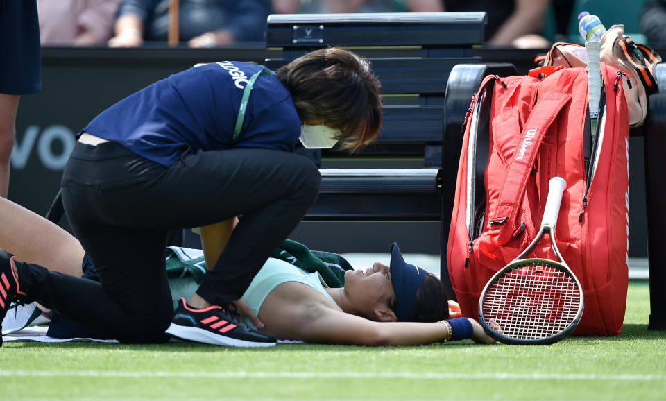 Emma Raducanu, pictured here receiving treatment on her side before retiring hurt in Nottingham.