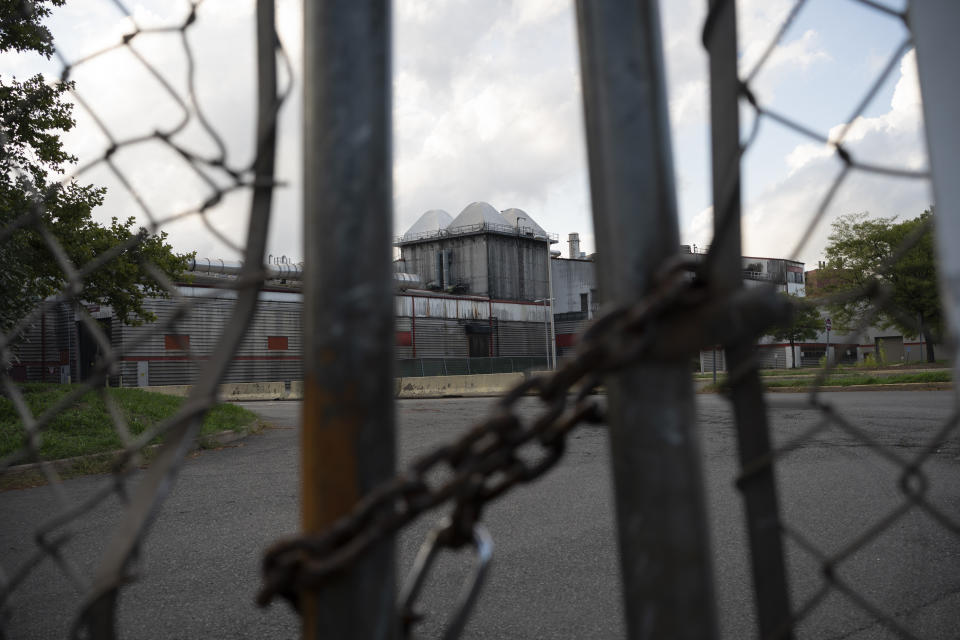 A former trash incinerator that closed earlier in the year is seen through locked gates in Hartford, Conn., Tuesday, Sept. 13, 2022. Though the closure was cheered by community members and environmental advocates, longtime residents argue too much pollution remains and too little consideration has gone to the long-term damage it has wrought. (AP Photo/Wong Maye-E)