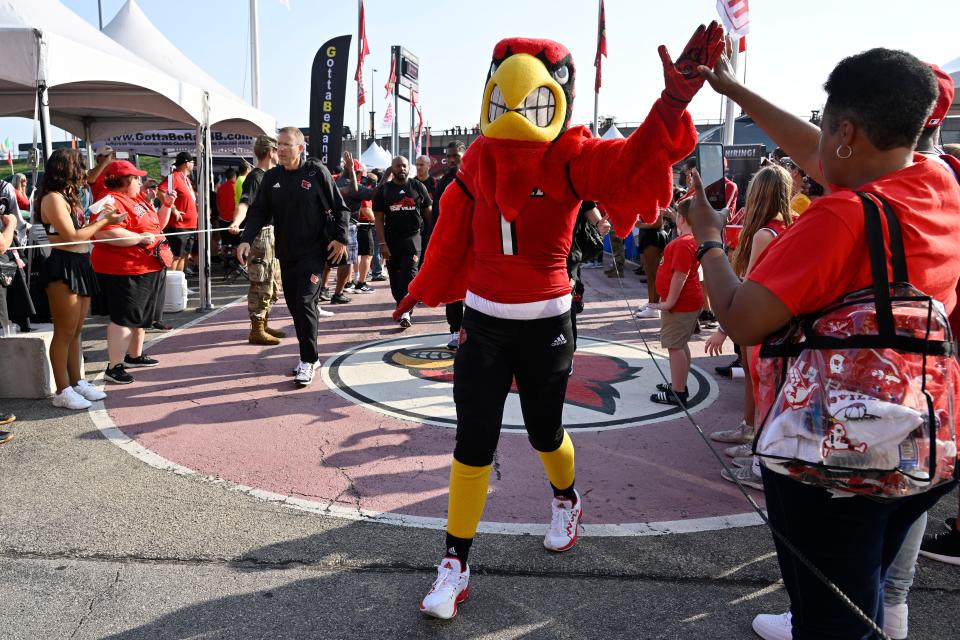 The Louisville mascot greets fans during the Card March before facing FSU on Sept. 16, 2022. The game drew 2.75 million TV viewers, the biggest audience for a Cardinals game that season.