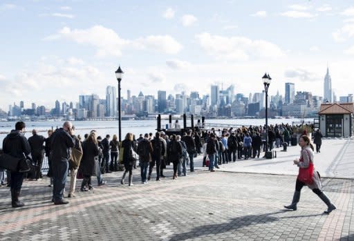 With limited functioning transportation options people wait for ferry tickets October 31, 2012 in Hoboken, New Jersey. Hurricane Sandy which made landfall along the New Jersey shore, has left parts of the state and the surrounding area flooded and without power