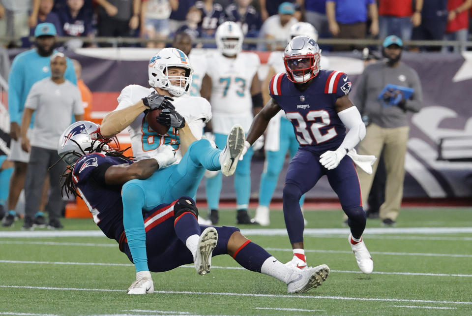 FOXBOROUGH, MA - SEPTEMBER 12: New England Patriots linebacker Donta Hightower (54) tackles Miami Dolphins tight end Mike Gesicki (88) during a game between the New England Patriots and the Miami Dolphins on September 12, 2021, at Gillette Stadium in Foxborough, Massachusetts. (Photo by Fred Kfoury III/Icon Sportswire via Getty Images)