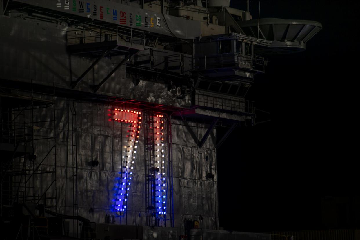 The “71” lights are lit aboard the Nimitz-class aircraft carrier USS Theodore Roosevelt on Aug. 5. The warship, undergoing an overhaul at the Puget Sound Naval Shipyard and Intermediate Maintenance Facility, will return to San Diego in February 2023.