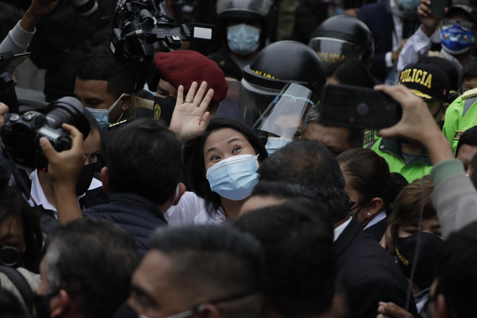 Presidential candidate Keiko Fujimori waves after voting in Lima, Peru, Sunday, June 6, 2021. Peruvians voted on Sunday in a presidential run-off election to choose between Fujimori, the daughter of jailed ex-President Alberto Fujimori, and Pedro Castillo, a political novice that until recent was a rural schoolteacher. (AP Photo/Guadalupe Pardo)