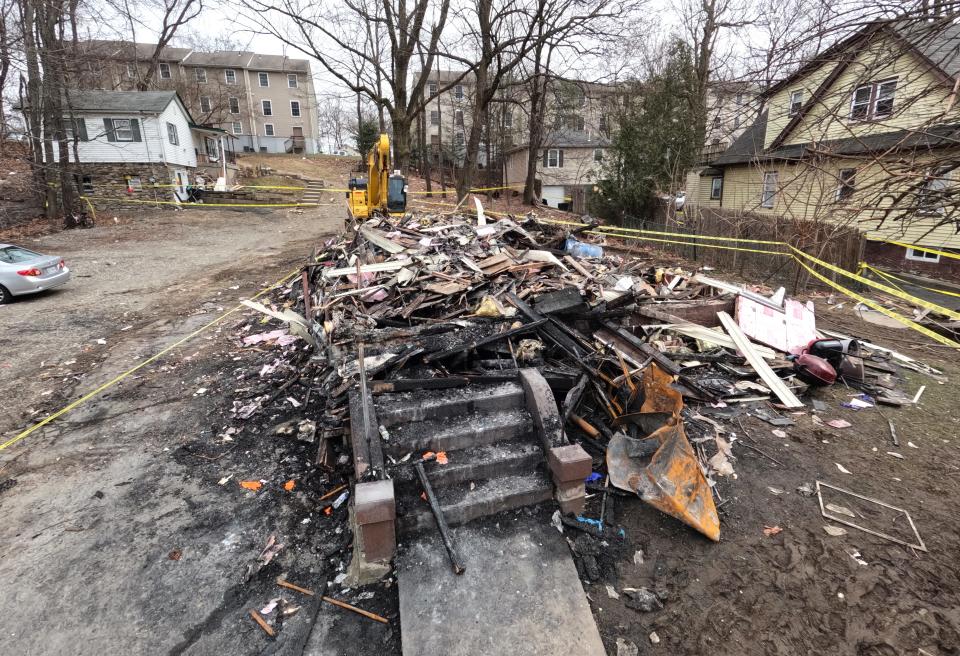 The remains of a fatal fire at a two-family building on Lake St. in Spring Valley March 6, 2023. Five people died in the fire.
