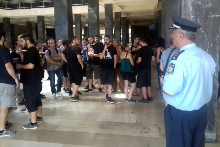 Demonstrators protesting against real estate auctions block the entrance to Thessaloniki's courthouse to notaries in June