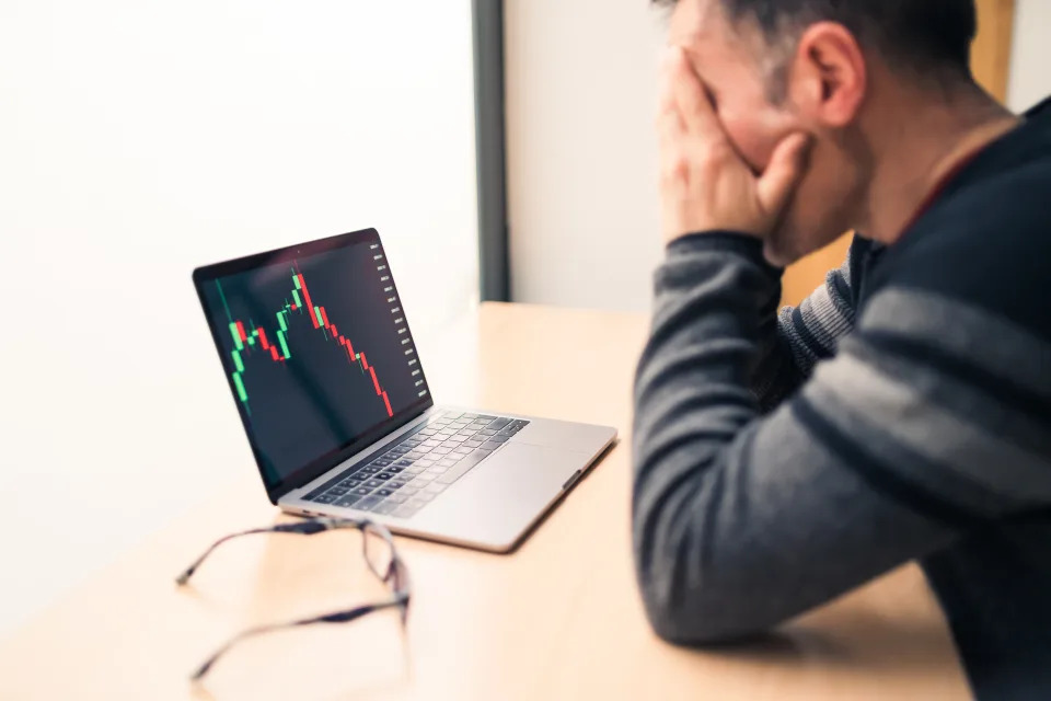 Man in his work office worried about the decline in the value of his business