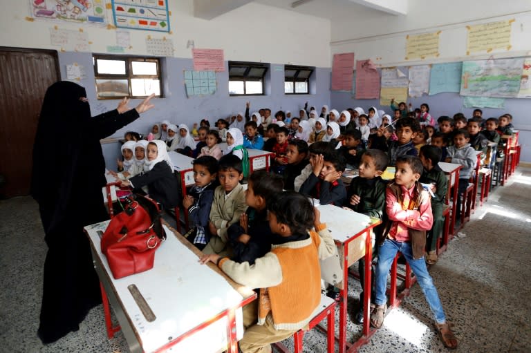 Yemeni students attend a class on the first day of the new school year in the capital Sanaa, on October 15, 2017