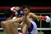 Muaythai boxers return to fight for the first time after temporary suspend due to the spread of the coronavirus disease (COVID-19) in Thailand