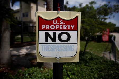 A "U.S. Property No Trespassing" sign is seen at ICE facilities as communities brace for a reported wave of ICE deportation raids in Miami