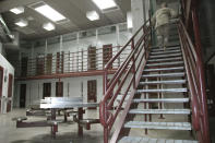 GUANTANAMO BAY NAVAL BASE, CUBA - JULY 23: In this image reviewed by the U.S. Military, a guard walks up a stairway inside a high-security portion of the detention center July 23, 2008 at Guantanamo Bay U.S. Naval Base, in Cuba. The military base is providing the location for the trial of Salim Hamdan, the former driver for Osama bin Laden, who is charged with conspiracy and aiding terrorism and is the first prisoner to face a U.S. war-crimes trial since World War II. (Randall Mikkelsen-Pool/Getty Images)