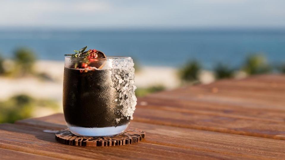 The Black Rita, a twist on the classic Margarita with a helping of charcoal and ginger syrup. 