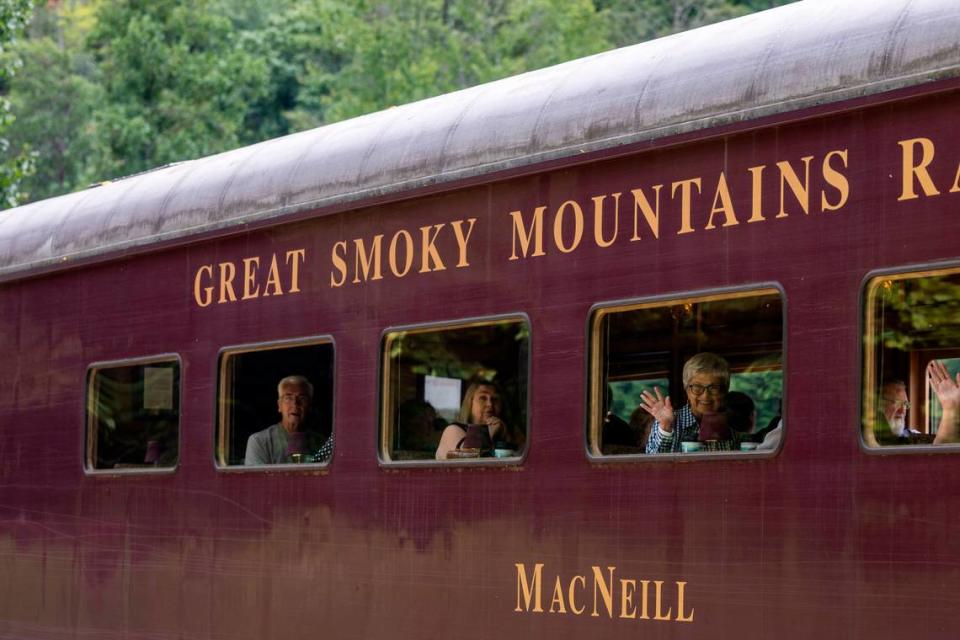 Tourists ride the Great Smoky Mountain Railroad during a steam engine excursion in the Nantahala Gorge.