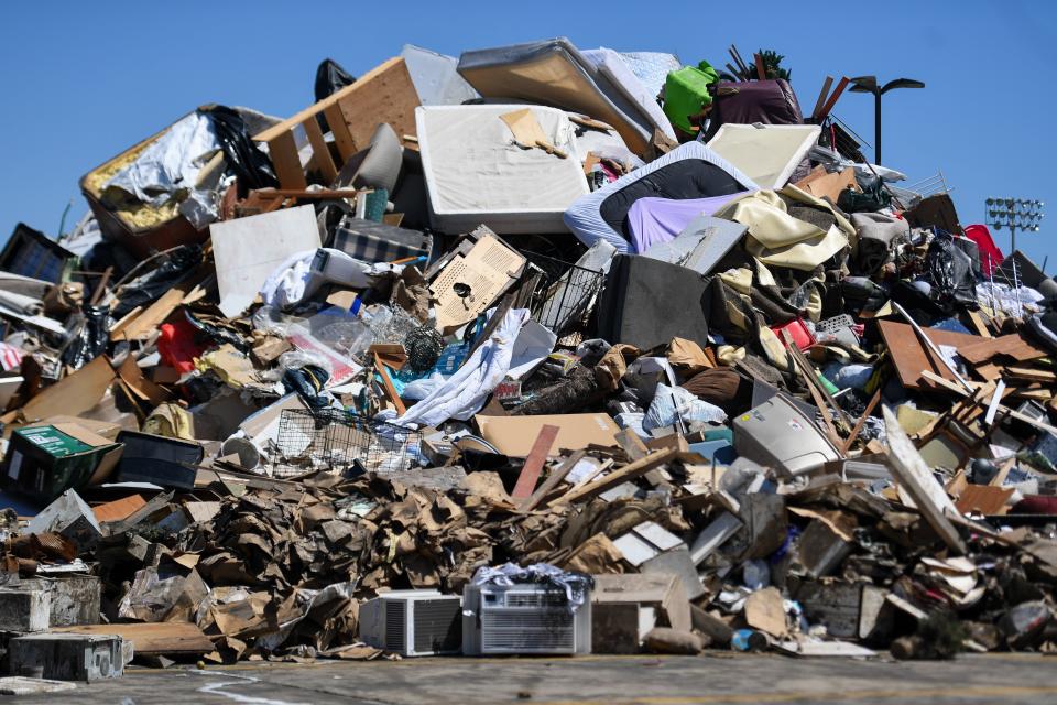 A pile of damaged items from the flooding the city’s residents experienced on Monday, June 24, 2024, at Canton Middle and High School in Canton, South Dakota.