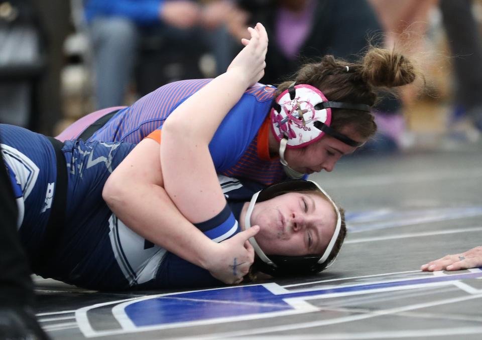 Taryn Martin, top, competes for Olentangy Orange at the 2021 state tournament.