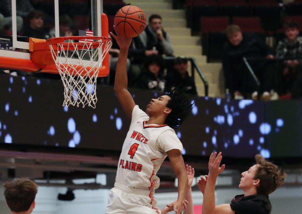 White Plains Logan McCormick (4) drives to the basket against Scarsdale during the Slam Dunk Showcase at the Westchester County Center in White Plains Jan. 6, 2024.