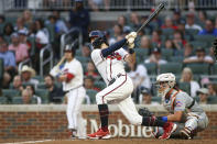 Atlanta Braves' Dansby Swanson watches his RBI double in the third inning of the team's baseball game against the New York Mets, Thursday, Aug. 18, 2022, in Atlanta. (AP Photo/Brett Davis)