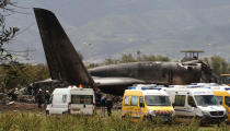 <p>Firefighters and civil security officers work at the scene of a fatal military plane crash in Boufarik, near the Algerian capital, Algiers, April 11, 2018. (Photo: Anis Belghoul/AP) </p>