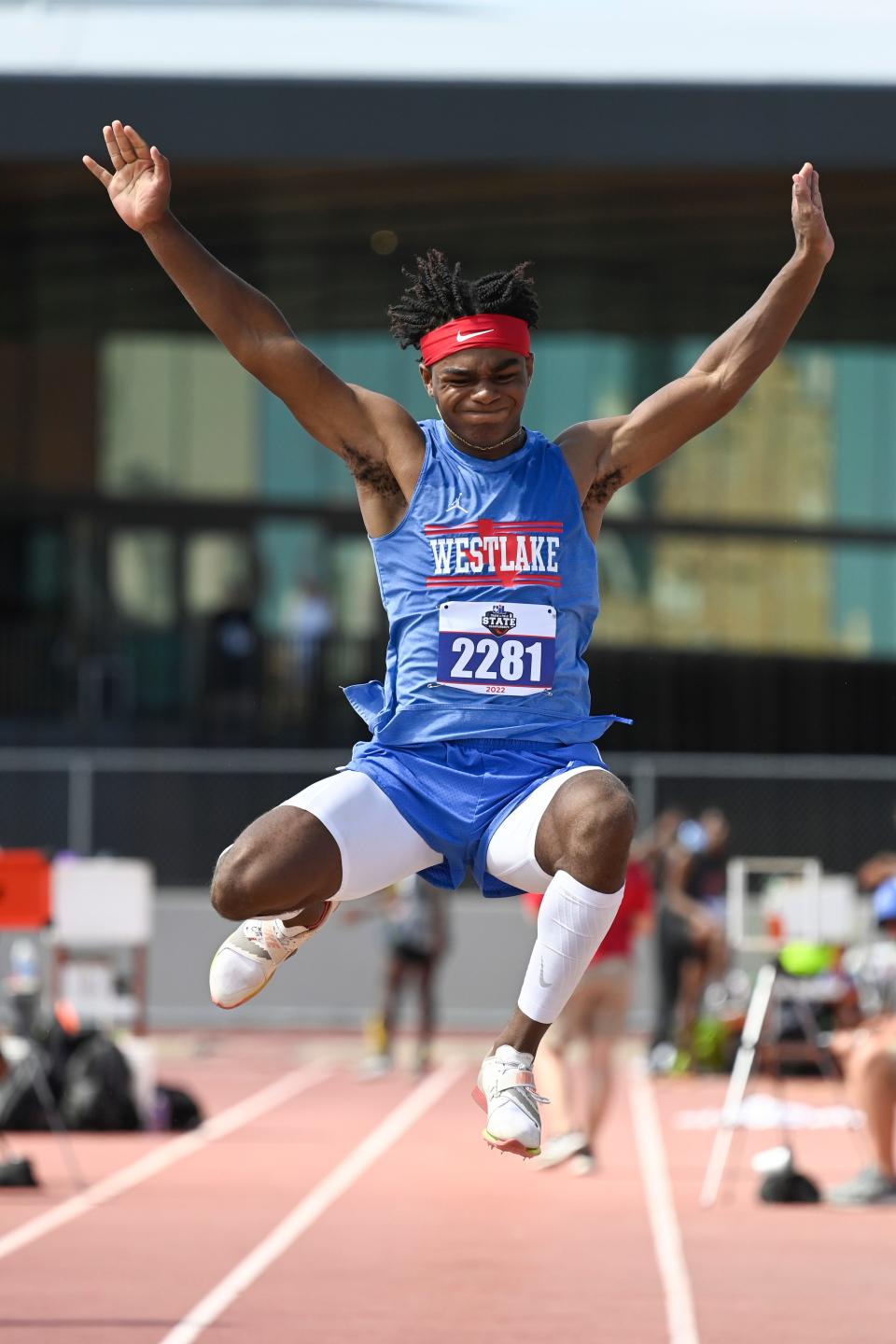 Westlake's Ashton Torns flies through the air on his way to a second-place finish in the boys 6A long jump at the UIL state track and field meet Saturday.