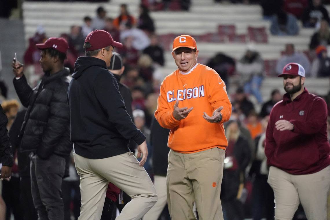 Clemson head coach Dabo Swinney, right, talks with South Carolina head coach Shane Beamer before an NCAA college football game Saturday, Nov. 27, 2021, in Columbia, S.C. Clemson won 30-0. (AP Photo/Sean Rayford) Sean Rayford/AP