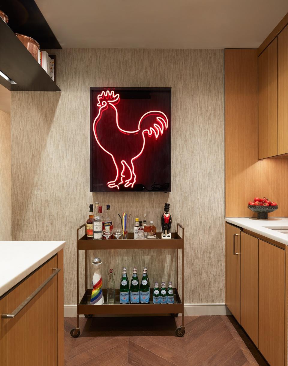 The glowing rooster in the kitchen is a custom piece done by Nights of Neon, in an homage to a New York bar called The Cock. “The bar is just signified by a red cock outside of it; there’s no other name for it,” Mikita says. “We had the rooster re-created, and then Jesse told me that roosters are actually good luck in the kitchen. So, it’s a double meaning,” Mikita says.