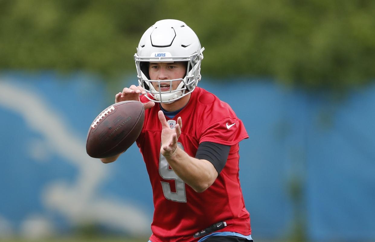 Detroit Lions quarterback Matthew Stafford takes a snap during drills at the team's NFL football practice facility, Tuesday, May 21, 2019, in Allen Park, Mich. (AP Photo/Carlos Osorio)
